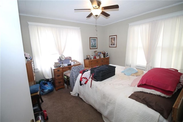 bedroom featuring ceiling fan, crown molding, and carpet floors