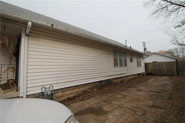 view of property exterior featuring a patio area