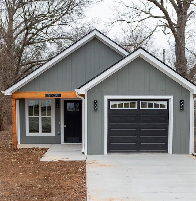 view of front of property featuring a garage and covered porch