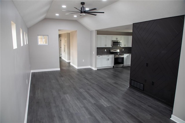 unfurnished living room featuring lofted ceiling, dark hardwood / wood-style floors, and ceiling fan