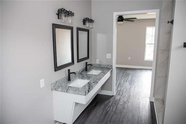 bathroom featuring vanity, hardwood / wood-style floors, and ceiling fan