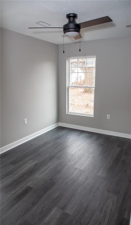 unfurnished dining area featuring ceiling fan, dark hardwood / wood-style flooring, and a textured ceiling