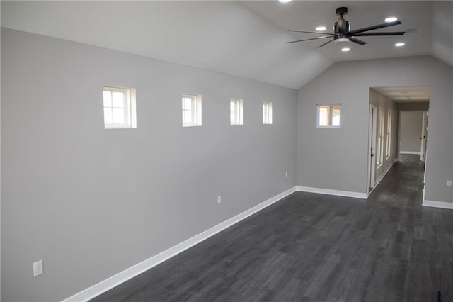 additional living space featuring vaulted ceiling, dark hardwood / wood-style floors, and a wealth of natural light