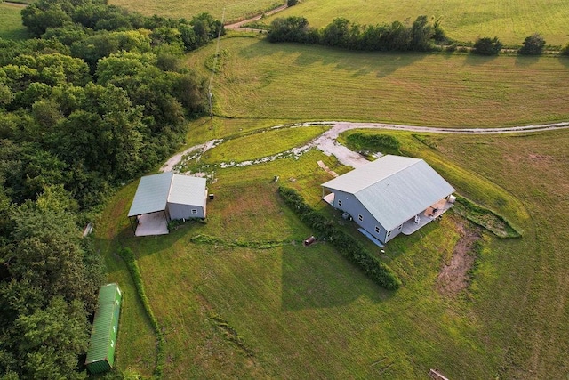 birds eye view of property with a rural view