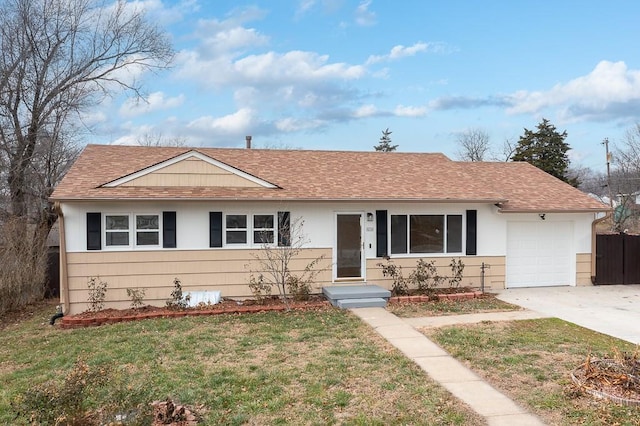 ranch-style house with a garage and a front yard