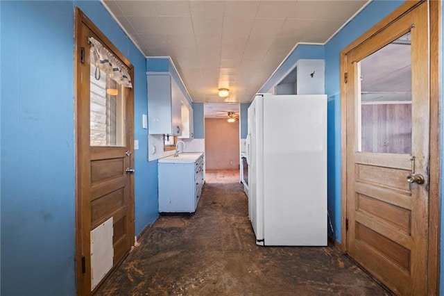 interior space with ceiling fan and sink