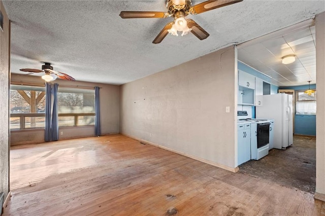 unfurnished living room with hardwood / wood-style flooring, ceiling fan, and a textured ceiling