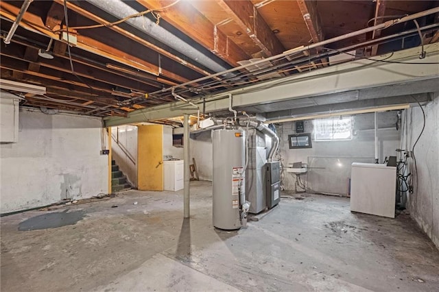 basement with gas water heater, sink, and washer / clothes dryer