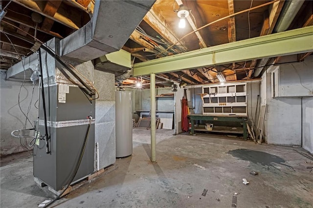 basement featuring heating unit and water heater