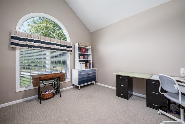 office space featuring light carpet and vaulted ceiling