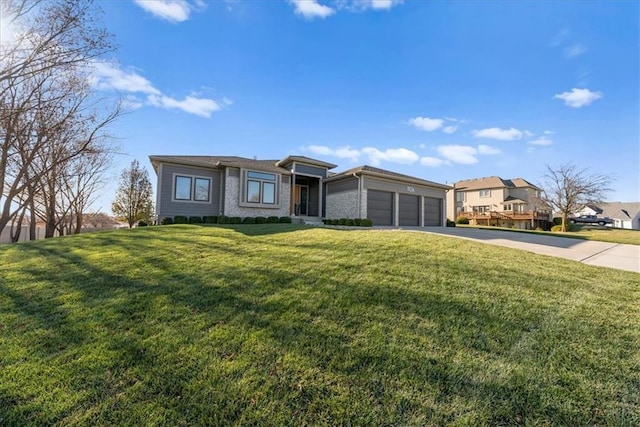 1106 Saxony Ct, Warrensburg, MO 64093 - prairie-style house with a garage, concrete driveway, and a front lawn