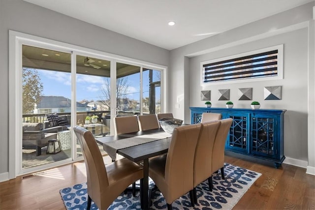 dining space featuring dark hardwood / wood-style flooring