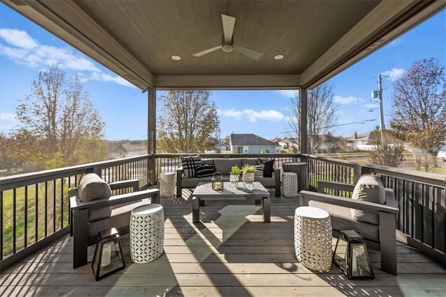 wooden deck with ceiling fan and an outdoor hangout area