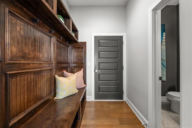 1106 Saxony Ct, Warrensburg, MO 64093 - mudroom featuring baseboards and wood finished floors