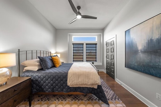 bedroom featuring dark hardwood / wood-style floors and ceiling fan