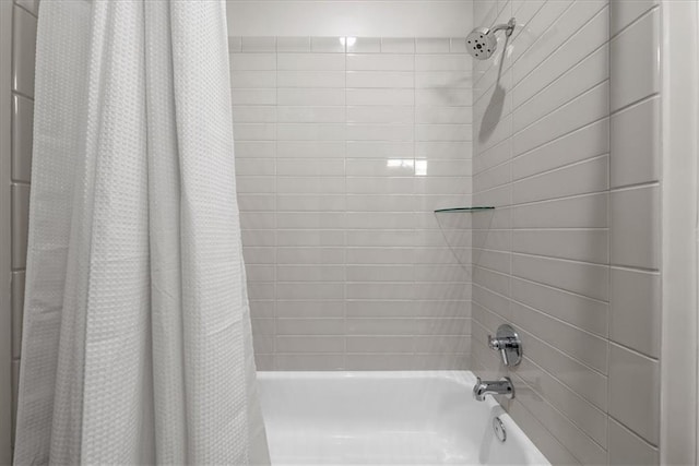 bathroom featuring shower / bathtub combination with curtain