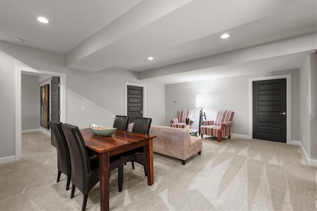 dining room with light colored carpet