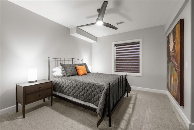 bedroom with ceiling fan and light colored carpet