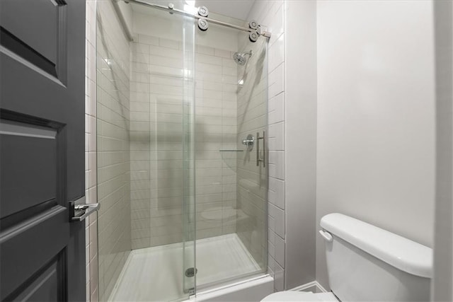 1106 Saxony Ct, Warrensburg, MO 64093 - bathroom featuring toilet and a stall shower