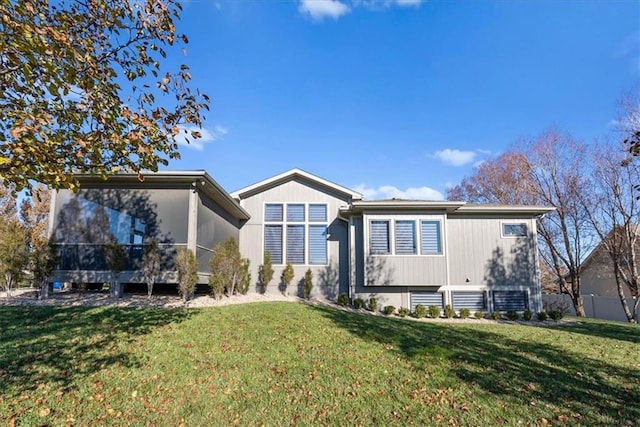 rear view of house with a lawn