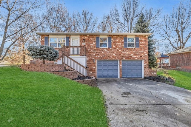 view of front of house featuring a front yard and a garage