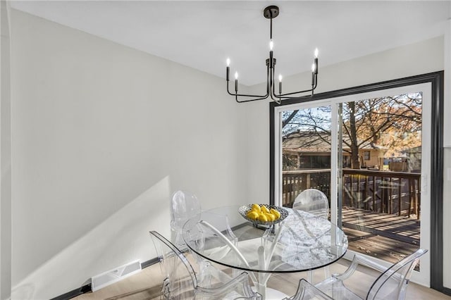 dining room with a notable chandelier