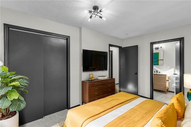 carpeted bedroom with an inviting chandelier