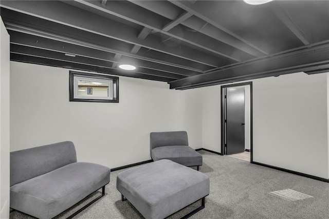 sitting room featuring light carpet