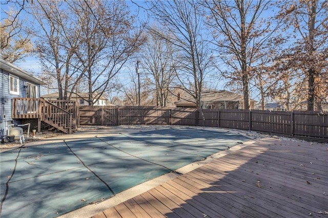 view of pool with a wooden deck