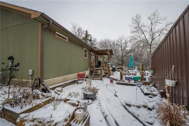 exterior space featuring a fire pit and a deck