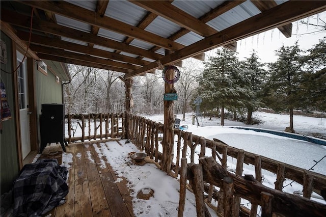 view of snow covered deck