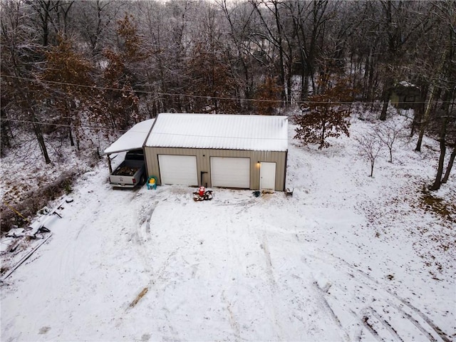 view of snow covered garage