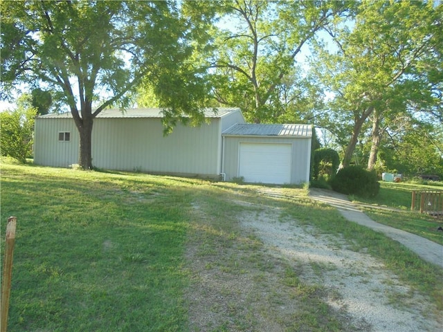 garage featuring a yard