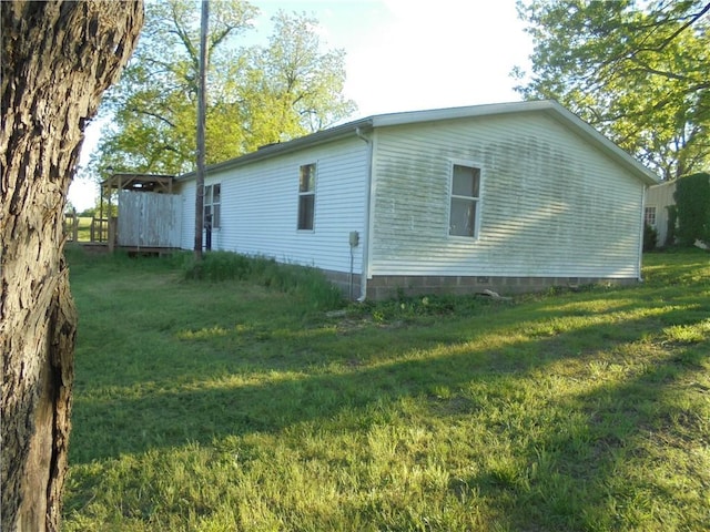 view of home's exterior with a lawn