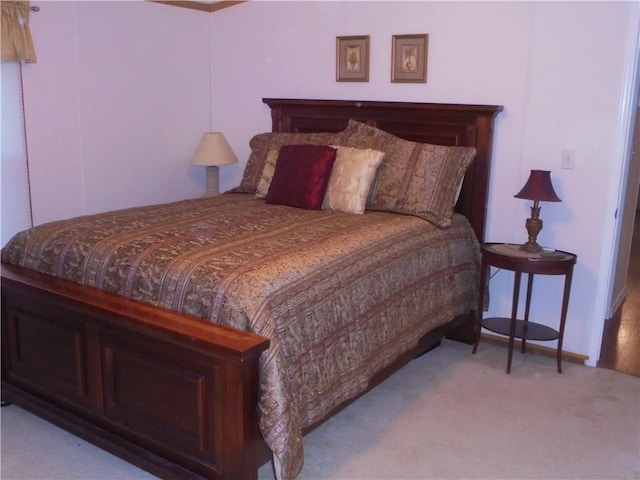 bedroom with light colored carpet