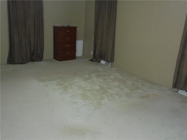 unfurnished bedroom featuring light colored carpet