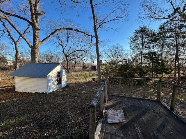 view of yard with an outdoor structure and a deck