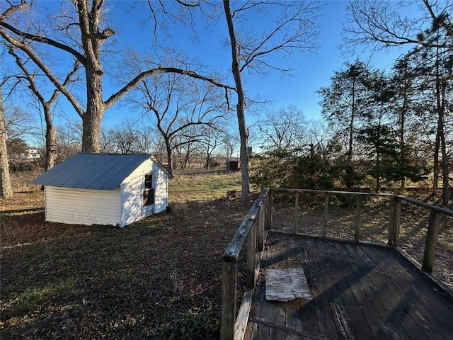 view of yard with an outbuilding and a wooden deck