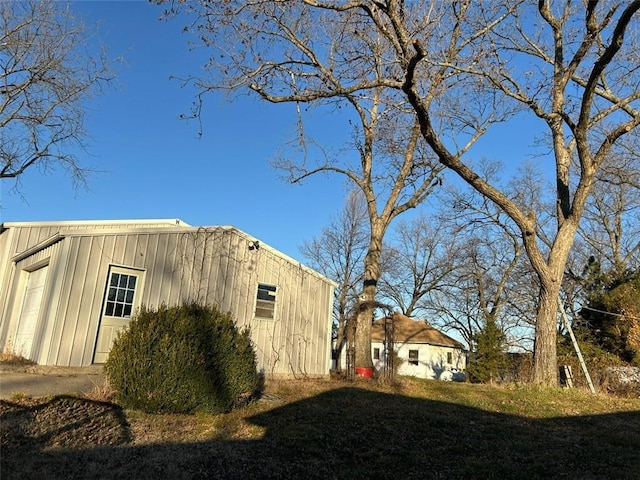 view of property exterior with an outbuilding and a garage