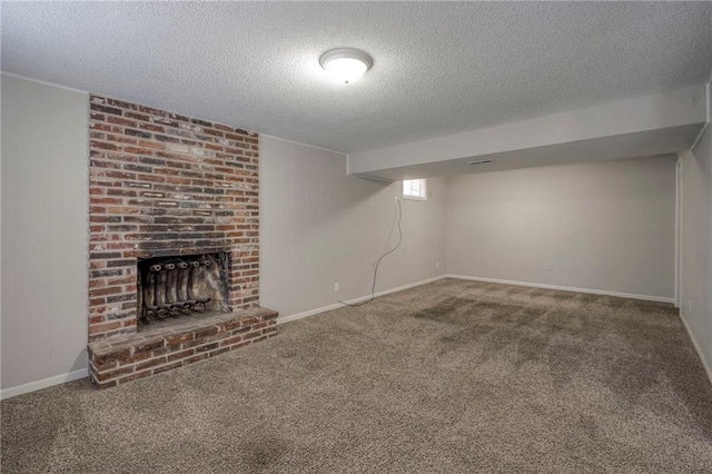 basement featuring carpet floors, a fireplace, and a textured ceiling