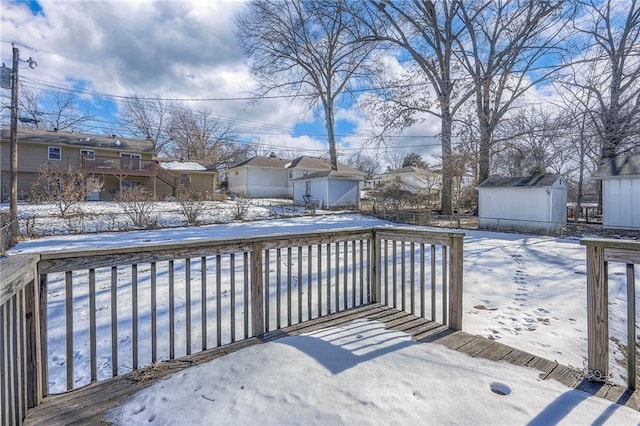 view of snow covered deck