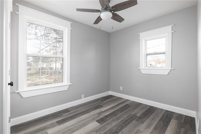 empty room featuring dark hardwood / wood-style floors and ceiling fan