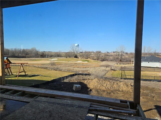 view of yard with fence and a playground