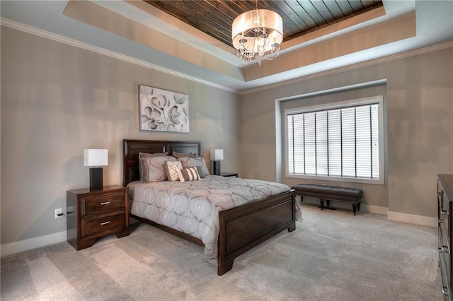 bedroom featuring light colored carpet, a tray ceiling, and a notable chandelier