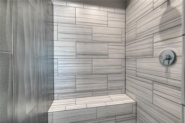 bathroom with a tile shower