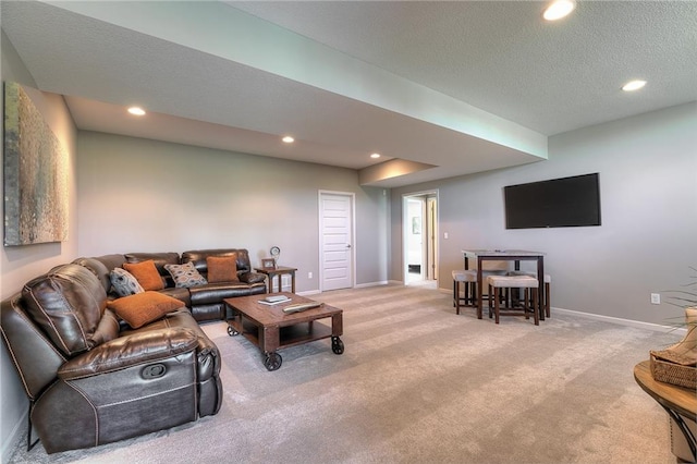 carpeted living room with a textured ceiling