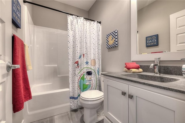 full bathroom featuring vanity, shower / bath combination with curtain, and toilet