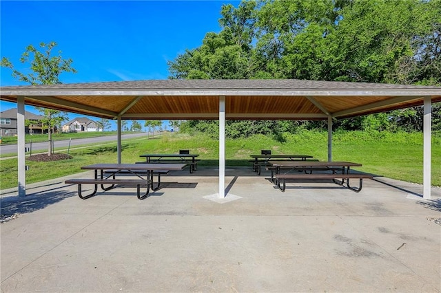 surrounding community with a gazebo and a lawn