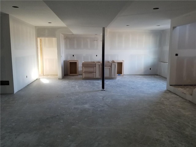 unfurnished room featuring concrete floors