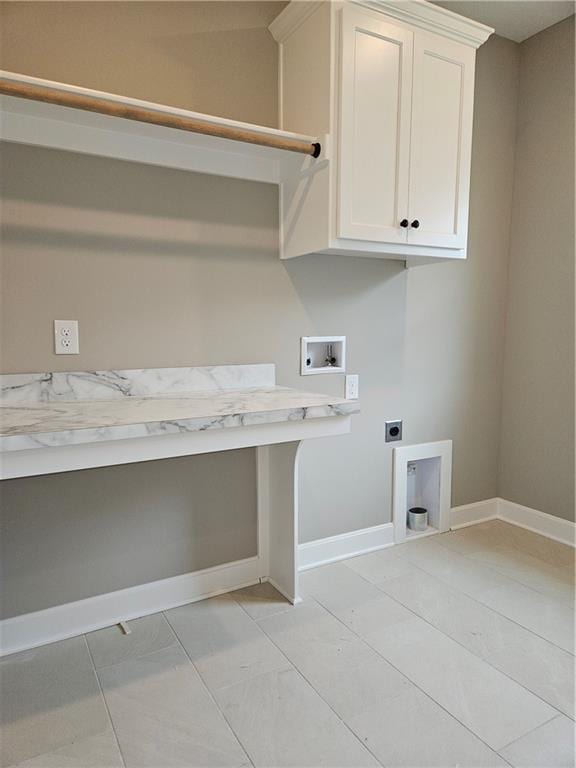 14608 Aspen Cir, Basehor, KS 66007 - laundry area with hookup for an electric dryer, cabinet space, hookup for a washing machine, and baseboards